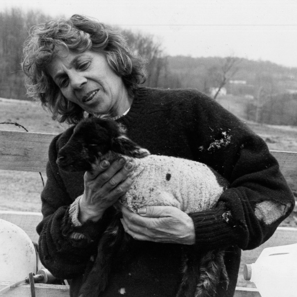 A photo of Jennifer's mother with a sheep.